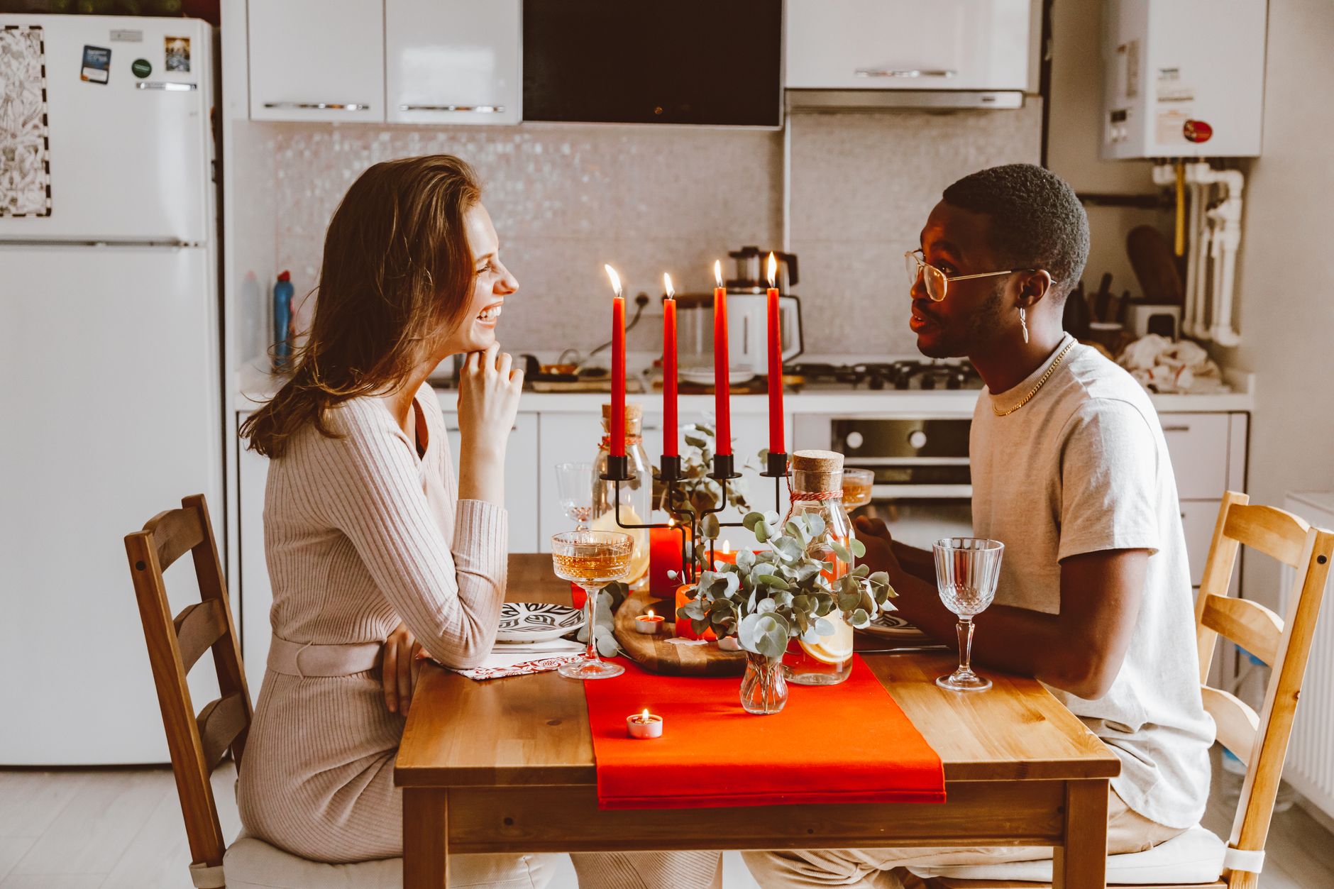 A couple talking calmly at the kitchen table