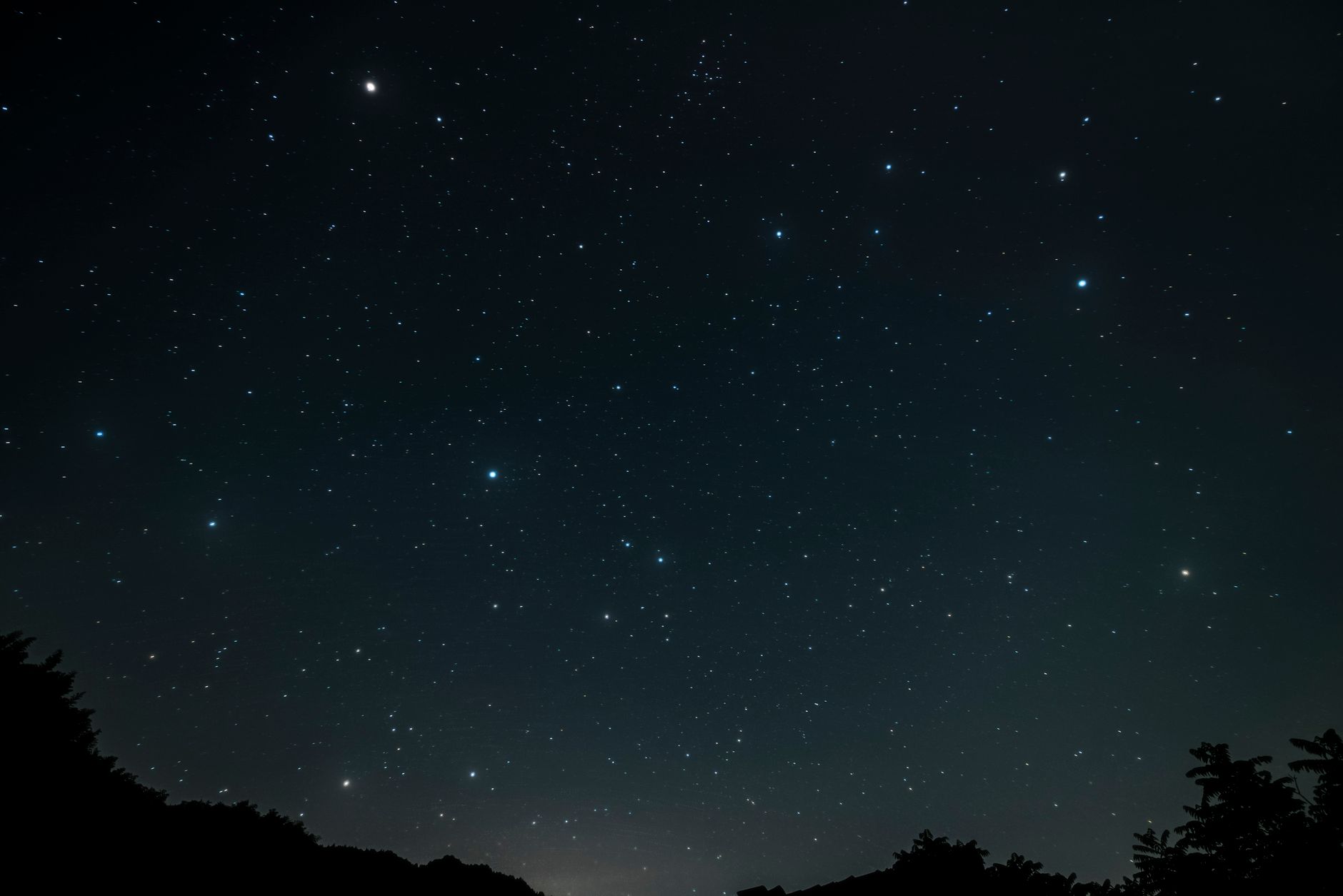 A starry night sky with visible constellations