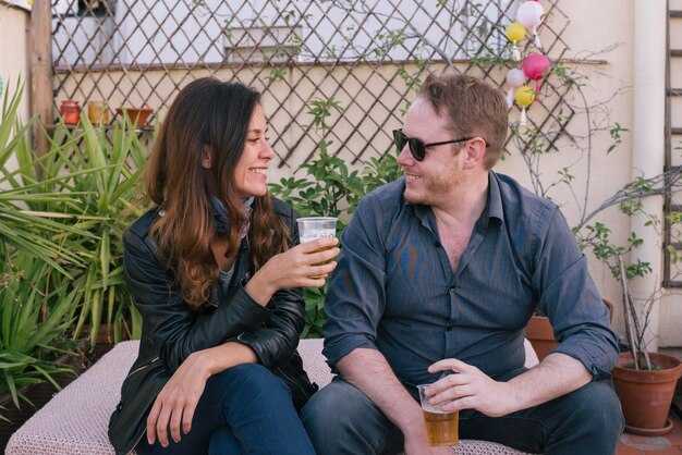 Select music and teach 8–12 simple local phrases to spark conversation